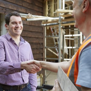 Customer Shaking Hands With Builder Customer Shaking Hands With Builder